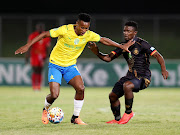 Themba Zwane of Mamelodi Sundowns shields the ball from Sphesihle Msomi of Royal AM during their Nedbank Cup semifinal at the Chatsworth Stadium.