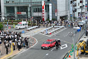 Police officers at the scene where former Japanese prime minister Shinzo Abe was shot during a political event in Nara on July 8 2022.