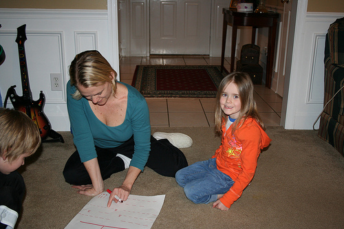 Family playing a game on the ground