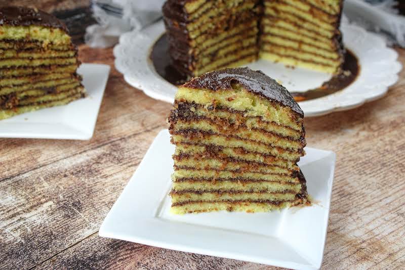 A Slice Of Old Fashioned Multi-layer Chocolate Cake.