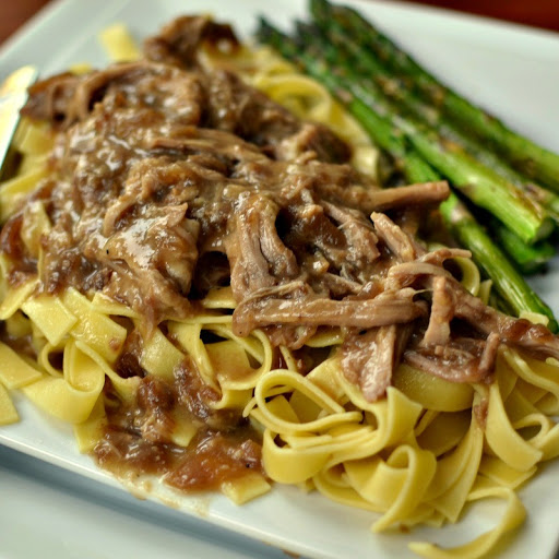 This delectable Slow Cooker Pork and Noodles combines pork tenderloin, Amish egg noodles and a super easy gravy that cooks up right in the slow cooker. It is the perfect family friendly comfort meal.