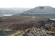 An undated picture of panoramic view of Panandhro Lightnite Mine, Kutch, Gujarat, India, showing the fossiliferous level (red arrow) where the remains of the prehistoric snake Vasuki indicus, obtained by Reuters on April 17 2024. 
