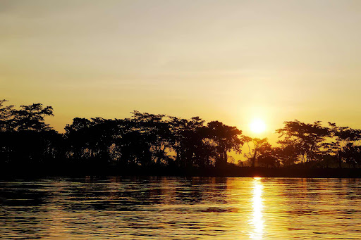 A view of the scenic Magdalena River in Colombia at sunset.