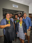 Cape Mint General Manager Howard Steenkamp (R) alongside the staff of Margaret's House including Centre Manager Mela boys from Margaret's House. Steenkamp's company recently made a donation to the home. 