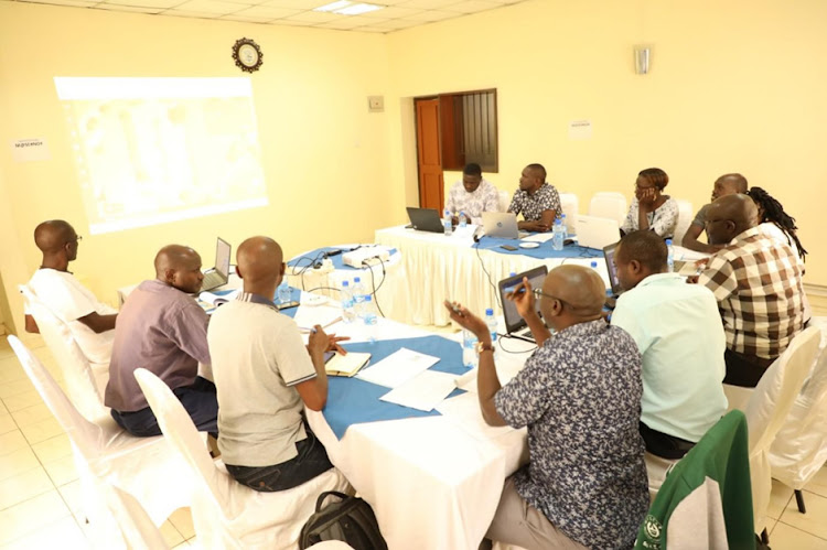 The Masinde Muliro university Solar Photovoltaic Energy Project Committee members during a brainstorming session.