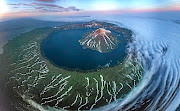 Onekotan is an uninhabited volcanic island, part of Russia's Kuril Islands chain in the northwest Pacific Ocean. The image is a 26-photo aerial-drone stitch of the island.