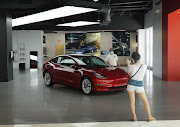 A Tesla vehicle is on display at a showroom in the Aventura Mall in Miami, Florida, US.