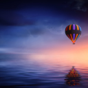 Hot air balloon flying over the sea