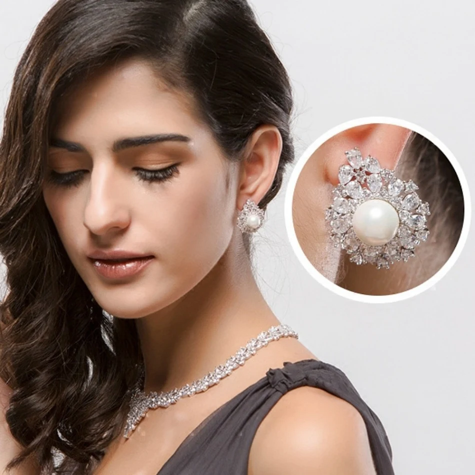 Boucles d'oreilles artisanales 5A avec perles de coquillage en zircon. Sublimez votre style avec éclat et raffinement, un bijou unique.