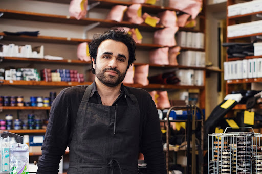 Business owner with a construction helmet