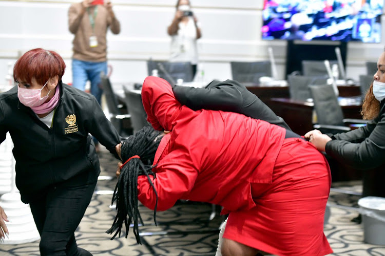 A female EFF MP dragged out of parliament by parliamentary security after she disrupted President Cyril Ramaphosa from delivering his budget speech.