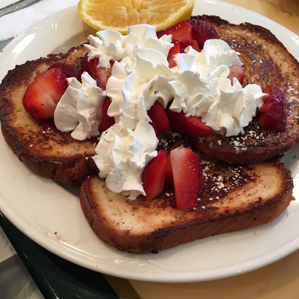 Gluten-free French Toast with strawberries and whipped cream. Delicious!