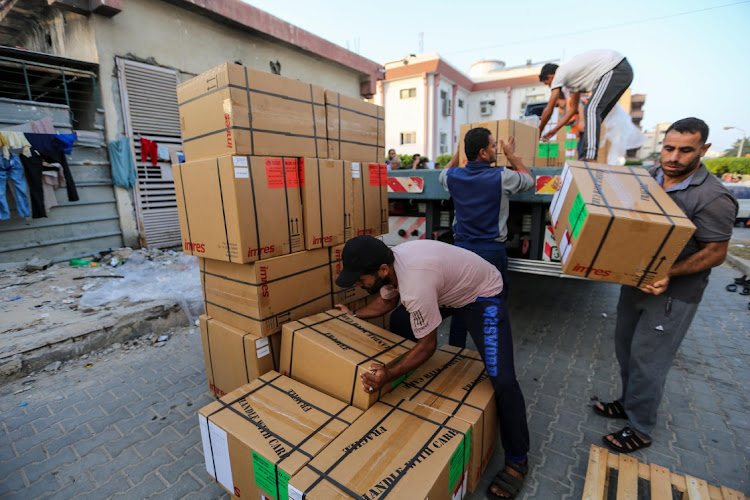 Distribution of medical aid and medicines to Nasser Medical Hospital in the city of Khan Yunis, south of the Gaza Strip, which recently arrived through the Rafah crossing on October 23. Aid trucks have started entering the Palestinian territory via Egypt but the UN Relief and Works Agency for Palestine Refugees (UNRWA), says the initial aid is a “drop in the ocean” of what is needed. Picture: Ahmad Hasaballah/Getty Images