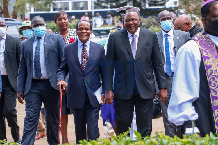 President Uhuru and St. John Ambulance Patron Marsden Madoka (L) accompanied by Wiper Party leader Kalonzo Musyoka, Nairobi County Governor Ann Kananu, CS Health Mutahi Kagwe, and other invited guests, during the Investiture ceremony by St. John at All Saints Cathedral, Nairobi on March 24, 2022.