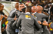 Orlando Pirates coach Jose Riveiro celebrates winning the MTN8 final against AmaZulu with his technical staff at Moses Mabhida Stadium in Durban on November 5 2022.