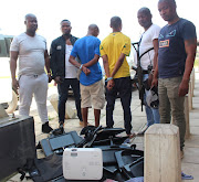 Members of the Provincial Task Team arrested two men and recovered computers and laptops stolen from a high school in Umlazi, south of Durban