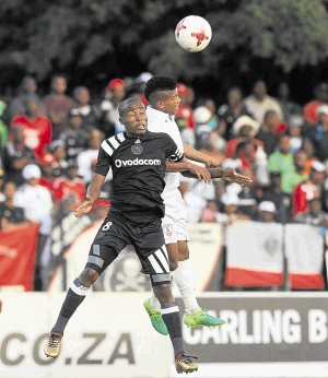 Pirates captain Thabo Matlaba goes for an aerial battle with Tebogo Potsane of Free State Stars during their clash on Saturday.