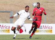 Nkanyiso Madonsela of Sekhukhune United challenged by Vusimuzi Mncube of JDR Stars.