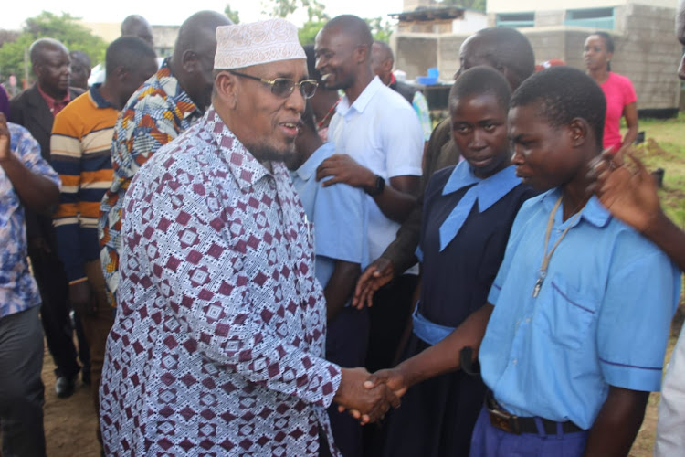 Cohesion Committee chairman Yussuf Haji welcomed by learners of Malaba Special school during the tour of the facility on Friday.