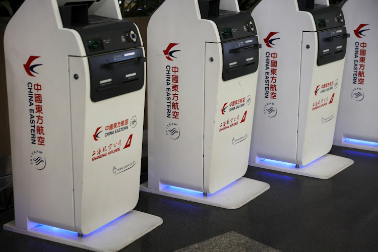 Logos of China Eastern Airlines are pictured on check-in kiosks at Beijing Capital International Airport in Beijing, China March 21, 2022.