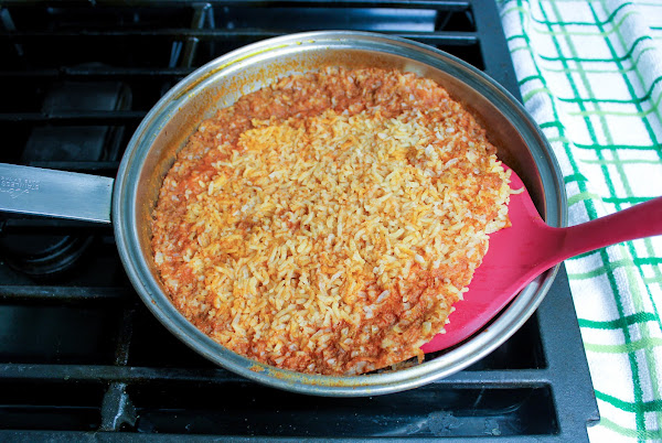 Stirring the cooked rice.