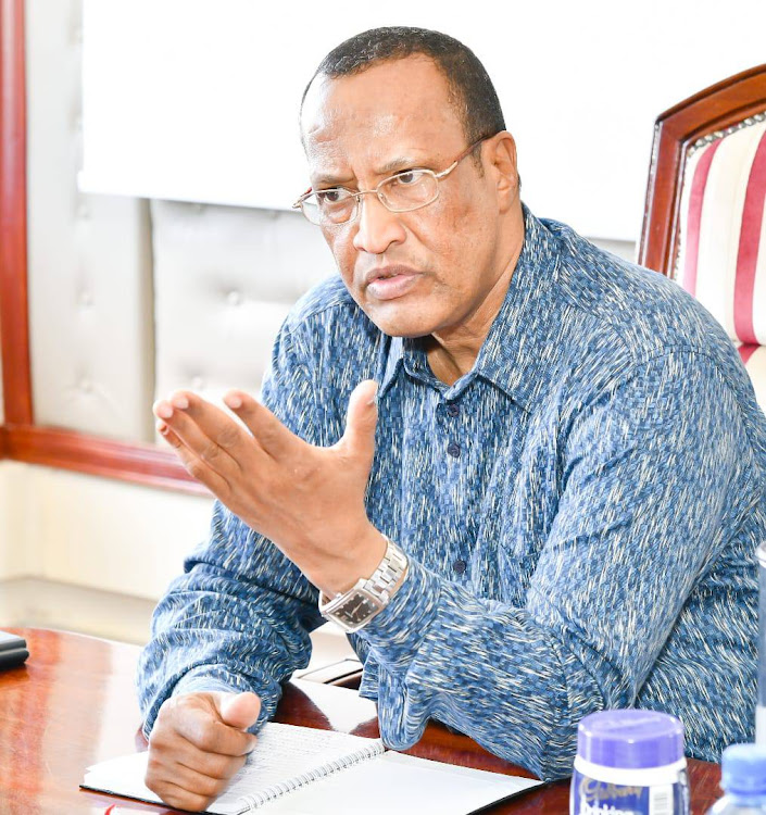 Garissa governor Nathif Jama when he met with officials from the Kenya Airports Authority and Lands ministry in his office.