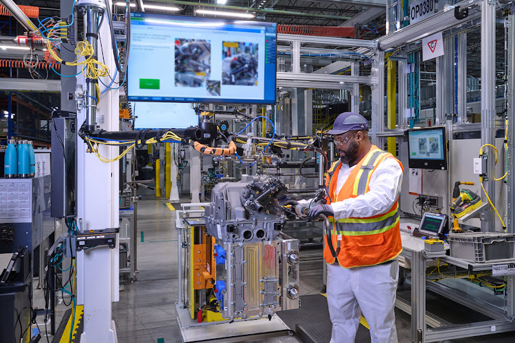 An employee assembles a fuel cell system in the module final assembly at Fuel Cell System Manufacturing LLC, GM and Honda’s fuel cell joint venture in Brownstown, Michigan.