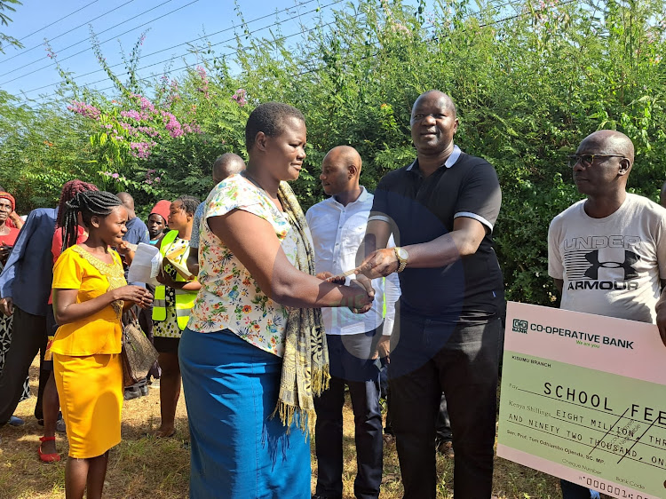 Kisumu Senator Tom Ojienda giving out cheques at his office in Kisumu on Monday, February 27,2023.