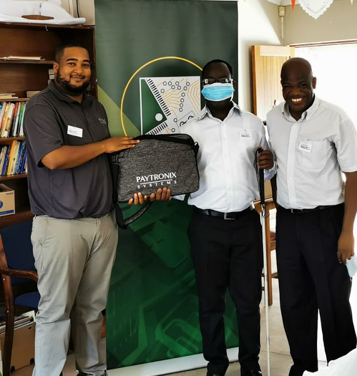 December Nkosi, who lost his eyesight as a child 34 years ago, would like to see blind people working productively instead of relying on government grants. From left are Ben Mabuza, Paytronix director, December Nkosi, founder of the Mbombela Blind Association and Fanie Msiza, director at Mbombela Blind Association.