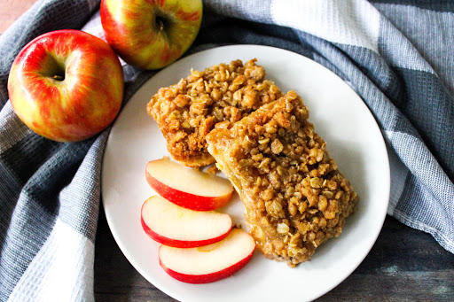 Two Apple Crumble bars on a plate.