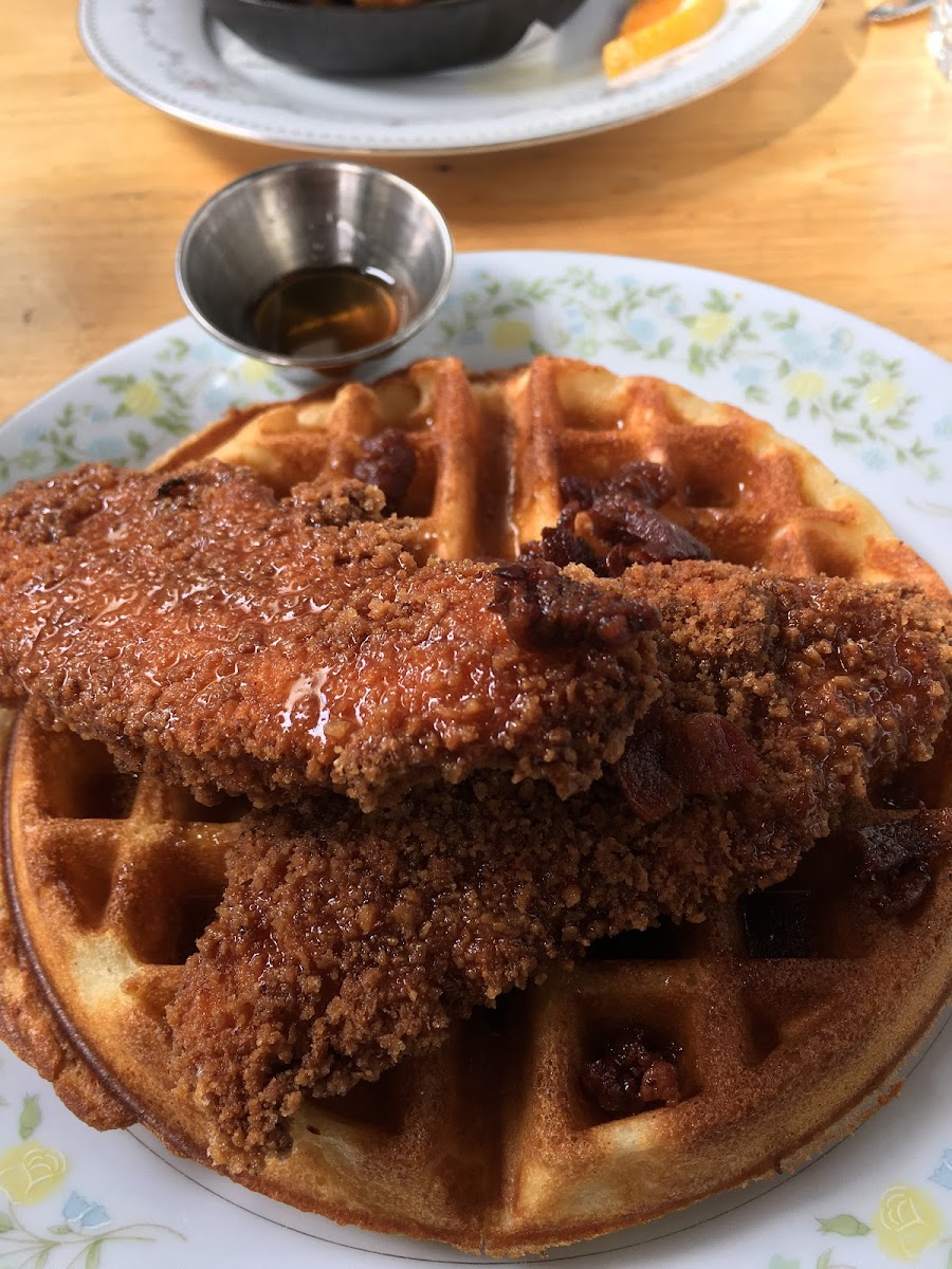 Celiac safe chicken and waffles with bacon bits and maple syrup. Soooooo good. So good I worried and kept asking about GF.