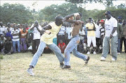 TAKE THIS: Fighters exchange blows during the launch of the musangwe tournament at the University of Venda on Saturday. 03/05/09. Pic. Chester Makana.