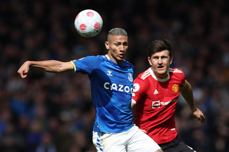 Everton's Richarlison in action with Manchester United's Harry Maguire