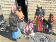 IN DIRE NEED OF  CARE: Tampie Phologolo, 82,   with her children Segametsi Phologolo, Kgomotso Phologolo, Mmaausi Phologolo and   two of her grandchildren.  Photo: Boitumelo Tshehle