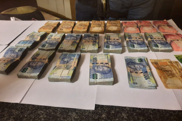 The proverbial long arm of the law has seized a large amount of cash from an Eastern Cape man's bedroom. The money was allegedly stolen from a retail store in Cape Town.