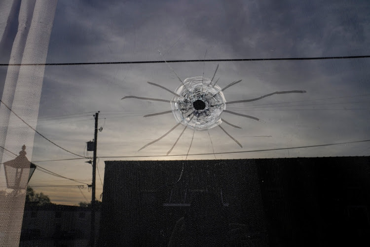 A bullet hole at the entrance of Mahogany Masterpiece Dance Studio the day after a shooting at a teenager's birthday party in Dadeville, Alabama, US, on April 16 2023.