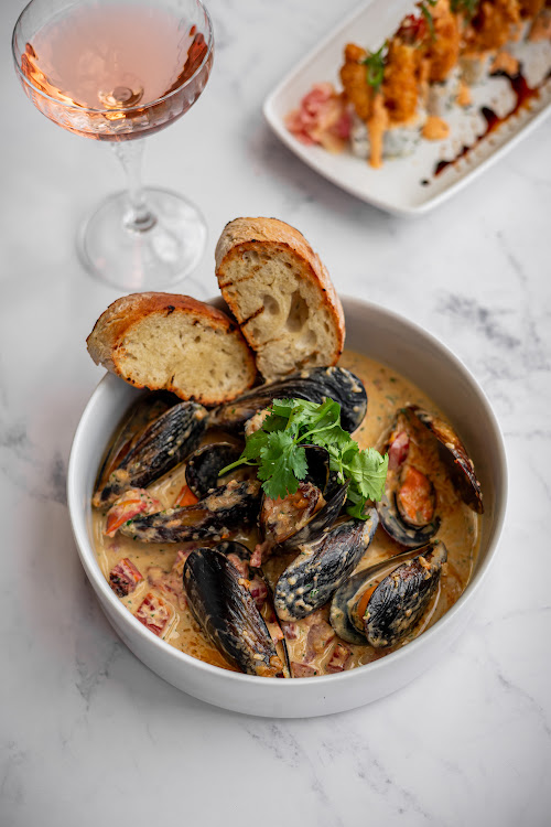 Fresh mussels steamed in white wine, herb butter, garlic and tomato.