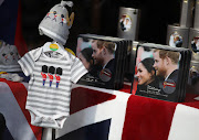 Items of baby clothing are displayed next to boxes of biscuits with photographs of Britain's Prince Harry and his wife Meghan Duchess of Sussex on the lid in the window of a gift shop in Windsor, Britain, May 1, 2019.  