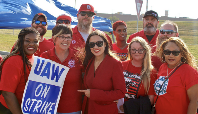 Picture of Reps. Bush and Ocasio-Cortez with local UAW members before the rally