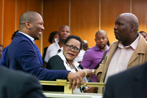 POINT OF HUMOUR: ANC regional secretary Phumlani Mkolo, left, Buffalo City executive mayor Zukiswa Ncitha, and deputy mayor Themba Tinta during the lunch break of the Nelson Mandela memorial fraud trial in East London yesterday Picture: STEPHANIE LLOYD