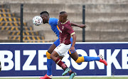 Erick Mathoho of Kaizer Chiefs and Ashley du Preez of Stellenbosch FC challenge for possession during the DStv Premiership match between Stellenbosch FC and Kaizer Chiefs at Danie Craven Stadium on January 23, 2021 in Stellenbosch, South Africa. 