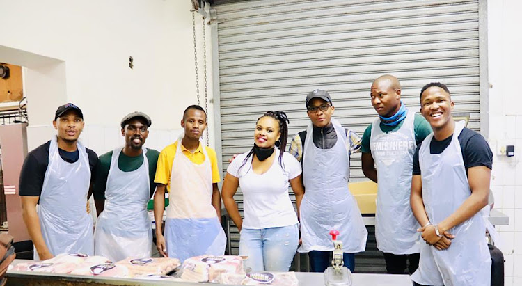 The Kasi Meats team after a day's work of making deliveries at their East London butchery. From left, Phumlani Mbulelo Ngceza, Kuhle Njoli, Sinethemba Njalula,Vuyolwethu Sabani, Solly Mdingi, Zola Velemani and Bohlale Buzani.