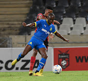 Peter Shalulile of Mamelodi Sundowns is shadowed by Pogiso Sanoka of TS Galaxy during their Dstv Premiership match at Mbombela Stadium on Tuesday.