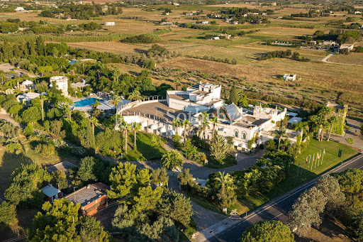 Aerial view white villa pool green garden in this luxury farmhouse for sale in Cutrofiano ($7,589,991 - 5,234 m²)