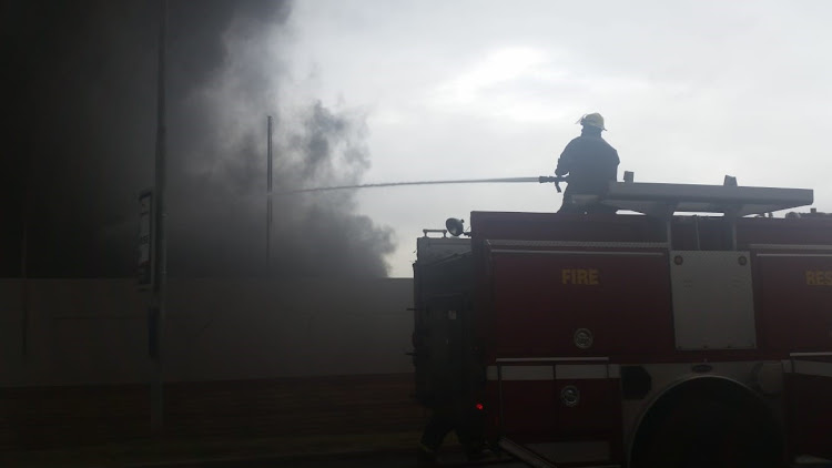 Firefighters tackle the blaze at the Hub on Tuesday morning.