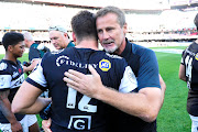 Cell C Sharks head cocah Robert du Preez hugs centre Marius Louw during the 2017 Currie Cup semifinal game against Blue Bulls at Kings Park, Durban on 21 October 2017. 