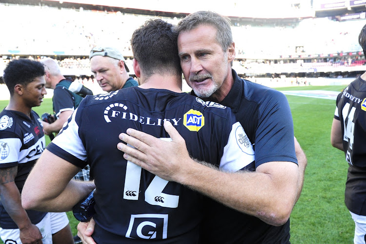 Cell C Sharks head cocah Robert du Preez hugs centre Marius Louw during the 2017 Currie Cup semifinal game against Blue Bulls at Kings Park, Durban on 21 October 2017.