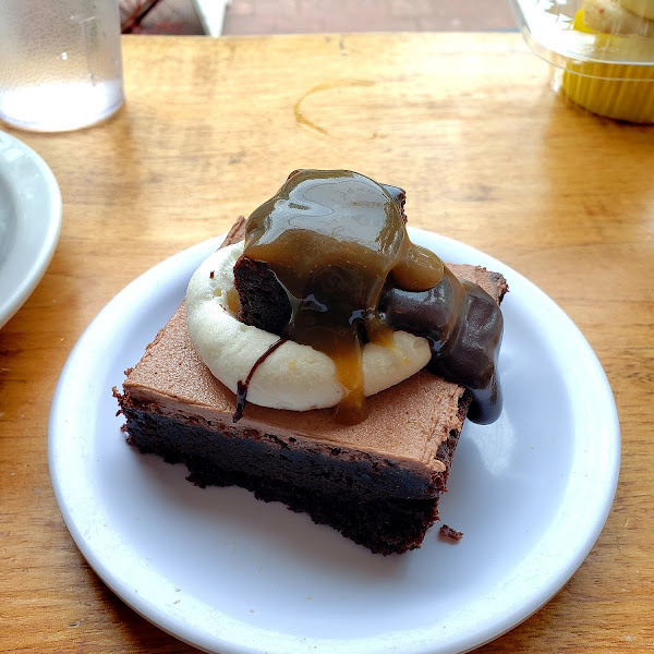 Mile High Brownie w/caramel sauce drizzle- Super decadent, moist, and delicious!