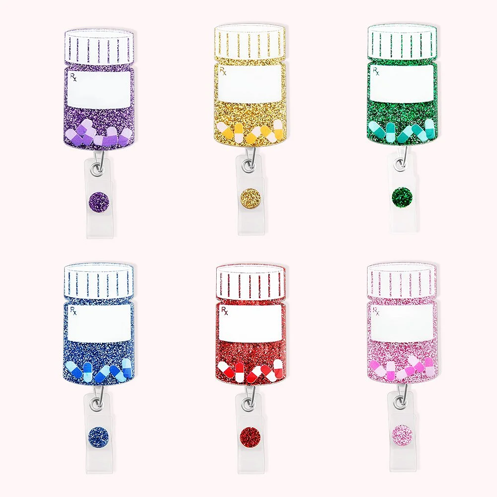 6 enrouleurs de badge de couleurs différentes en forme de boîte contenant des pilules.