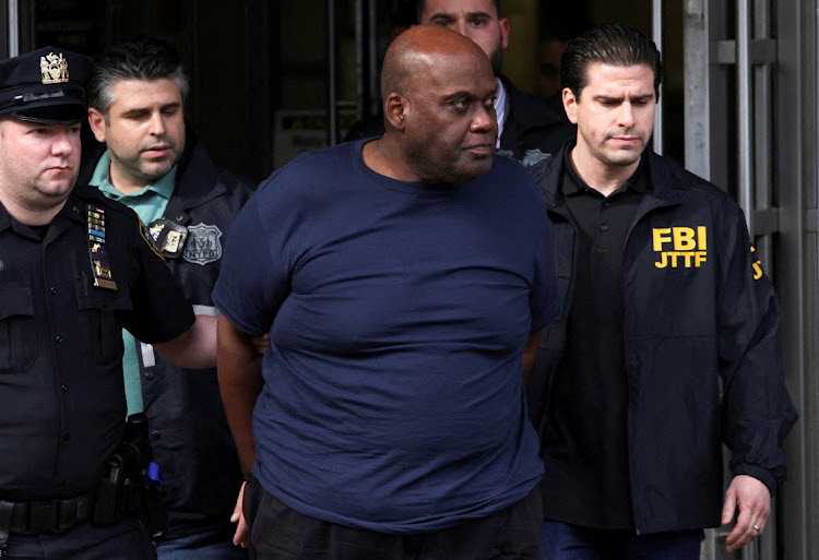 Frank James, the suspect in the Brooklyn subway shooting walks outside a police precinct in New York City, New York, US, April 13, 2022.